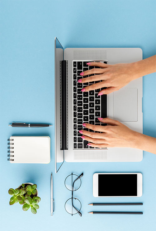 Workspace with laptop and stationery
