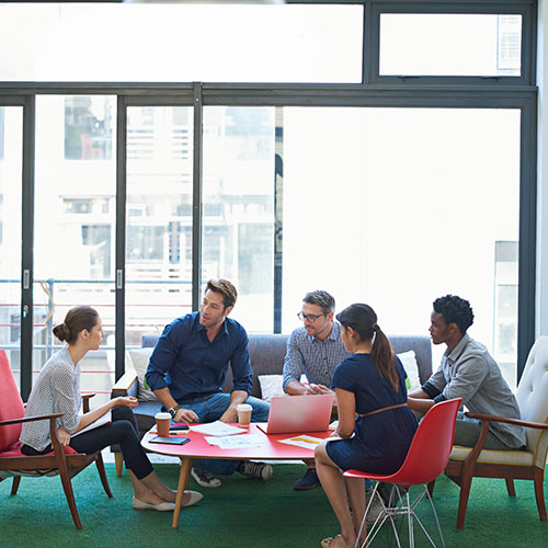 Group meeting in modern office setting.